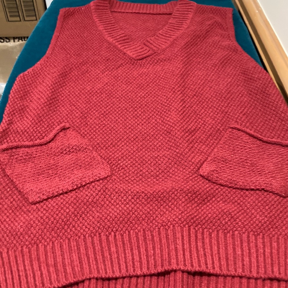 New small misses acrylic vest in a rusty red.